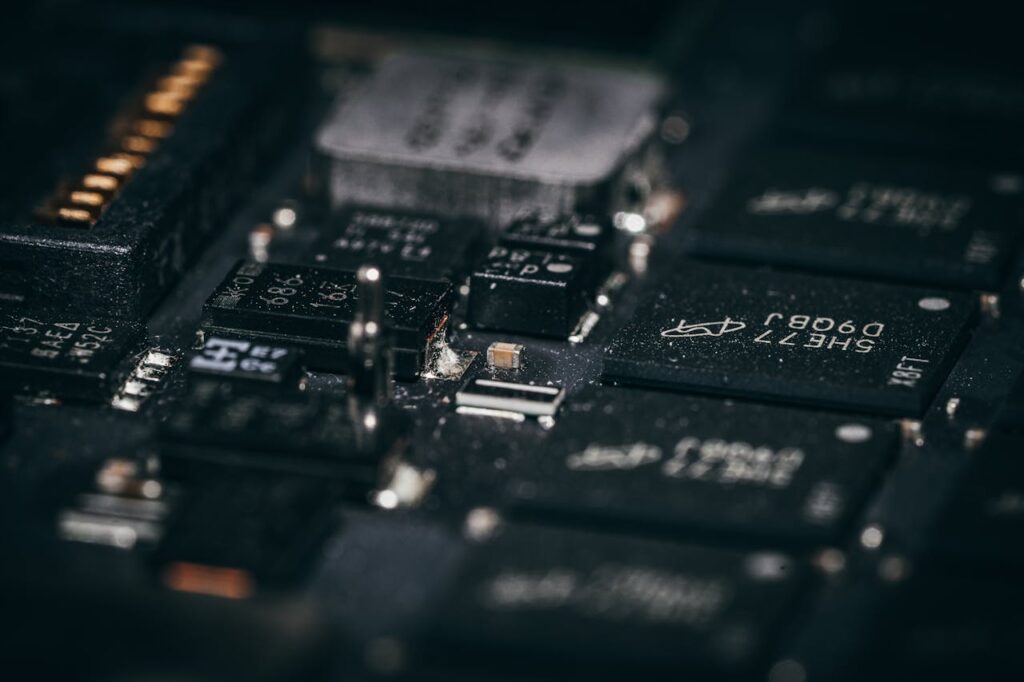 Detailed macro shot of electronic circuit components showcasing intricate design and layout.